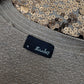 Bronze sequin bolero, garment tag